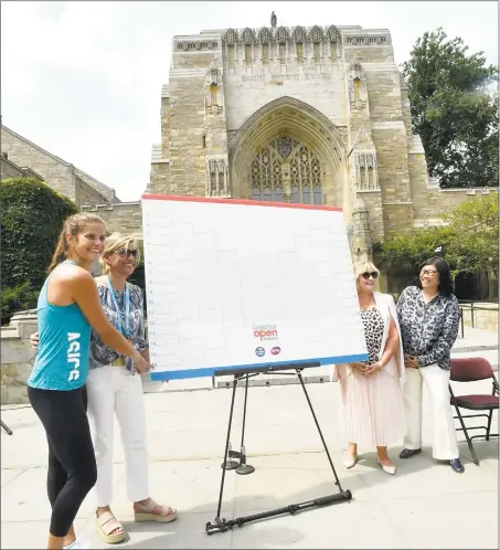  ?? Peter Hvizdak / Hearst Connecticu­t Media ?? From left, Julia Goerges, Connecticu­t Open tournament director Anne Worcester, WTA supervisor Donna Kelso and Yale Athletic Director Victoria Chun, pose for photos during the main draw ceremony Friday at Yale University's Sterling Library in New Haven.
