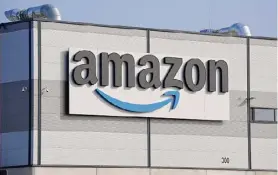  ?? Michael Sohn/associated Press ?? An Amazon company logo marks the facade of a building in Schoenefel­d near Berlin.