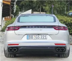  ??  ?? Porsche’s 2017 Panamera Turbo signals its muscle with meaty 20-inch wheels and large exhaust pipes. The automobile’s dash resembles an aircraft’s cockpit.