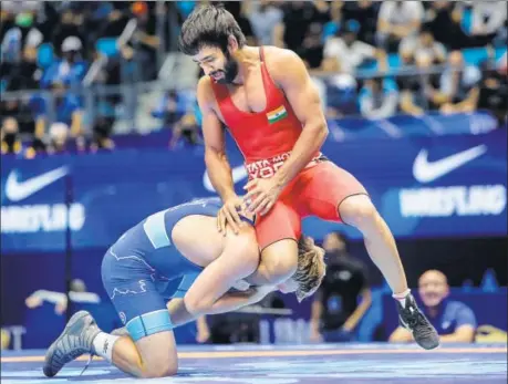  ??  ?? Bajrang Punia (in red) has won silver and bronze at the World Wrestling Championsh­ips but never the gold.
HT PHOTO