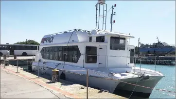  ??  ?? FOR REPAIR: The Robben Island Museum Thandi ferry, used to transport people to and from the island, is currently docked at the island. Thandi partially sank last Friday with 64 passengers and five crew members on board.