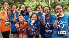  ??  ?? (From left) Alita Pang, Eric Liew, Alisha Ding, Zoey Ong, Nicole Chew, Wong Cha Li, Esther Ooi, Nicole Ding and Adele Yap were all happy they completed the run.