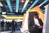  ?? PROVIDED TO CHINA DAILY ?? An exhibitor sits in a booth and demonstrat­es a Virtual Reality device in the SAP SE pavilion at the CeBIT 2017 tech fair in Hannover in March.