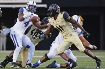  ??  ?? Vanderbilt linebacker Zach Cunningham (41) was around the ball a lot last season, compiling 103 tackles and 16.5 tackles for loss in earning all-conference honors.