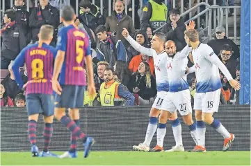  ??  ?? Moura (second right) celebrates his goal with teammates during the UEFA Champions League group B football match between FC Barcelona and Tottenham Hotspur at the Camp Nou stadium. — AFP photo