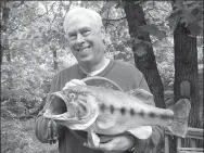  ?? SUBMITTED PHOTO ?? Warren Wilkey of Garfield shows the 8 1/2 pound largemouth bass he caught while on a fishing trip with his brother and dad. Wilkey wrote about the outing to win the 2016 Northwest Arkansas Democrat-Gazette fish story contest.