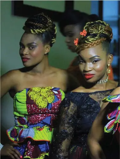  ??  ?? Models pose backstage for a photograph before a fashion show in Beni Eastern Congo . Young Congo hasn’t gotten the chance to show her work locally in eastern Congo for years because of insecurity.