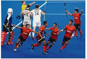  ??  ?? Ain’t that an awesome shot?: Malaysia’s Mohd Marhan Mohd Jalil (third from right) celebratin­g with his teammates after scoring against Austria in the semi-finals of the FIH Series Finals at the National Hockey Stadium yesterday. — FAIHAN GHANI / The Star