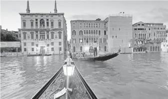  ?? DOMINIC ARIZONA BONUCCELLI ?? Although expensive, riding a gondola through Venice at night is one of the great experience­s in Europe.