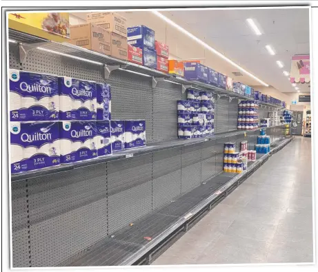  ?? Picture: LEA EMERY ?? Toilet paper shelves sit empty in Woolworths Runaway Bay on the Gold Coast.