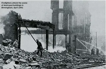  ??  ?? Firefighte­rs attend the scene of destroyed buildings in Birmingham, April 1941