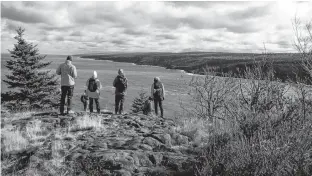  ?? HIKE NOVA SCOTIA ?? A group of hikers on the coast near Digby overlooks Gulliver’s Cove — just one of many adventures offered by Hike Nova Scotia through the organizati­on’s Fall Guided Hike and Walk Series available in the regions of Annapolis Valley, Halifax, Highland, Fundy and the South Shore.