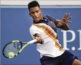  ?? CHANG W. LEE / THE NEW YORK TIMES ?? One rising player of color, 18-year-old Felix Auger-Aliassime of Canada, returns a shot during his first-round match Aug. 27 against fellow Canadian Denis Shapovalov at the U.S. Open.