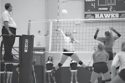  ?? Staff photo by Evan Lewis ?? Pleasant Grove’s Madi Morris spikes the ball during the second game against North Lamar on Tuesday. The Hawks won the match.