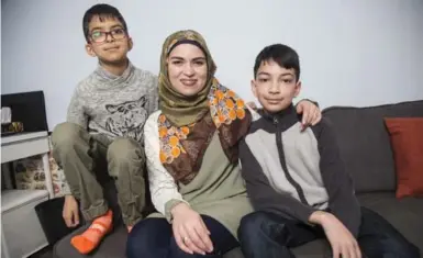  ?? BERNARD WEIL/TORONTO STAR ?? Culture is family, history and tradition, writes Uzma Jalaluddin, with sons Ibrahim Merchant, 9 and Mustafa Merchant, 12.