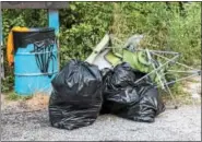  ??  ?? Blue Mountain Wildlife Inc. volunteers collect trash in the Kernsville Dam Recreation Area and the trails leading to Peace Rock. One volunteer Fishin’ Joe Sweider is out everyday collecting what everyone leaves behind.