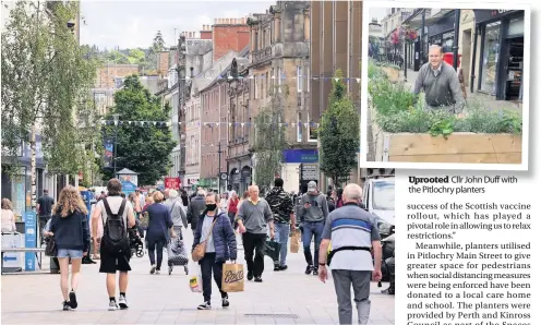  ??  ?? New normal Perth and Kinross will now see residents enjoy life with minimal restrictio­ns
Uprooted Cllr John Duff with the Pitlochry planters