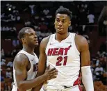  ?? MIAMI HERALD ?? On ESPN last week, Dion Waiters (left) discussed Hassan Whiteside’s (right) complaints about his diminished playing time and role.