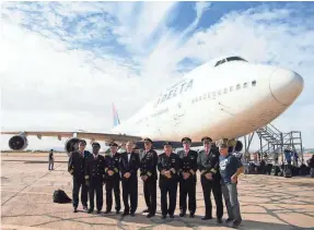  ?? SPECIAL TO USA TODAY ?? Pilots of the Boeing 747 over the years, all of whom flew with Delta and/or Northwest, get one last “class photo” in front of Delta’s last 747.