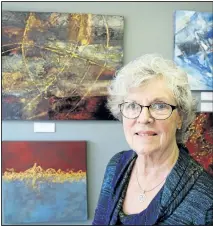  ?? CLIFFORD SKARSTEDT/EXAMINER ?? Local artist Patti Fontaine next to a selection of her artwork on display Tuesday at Nancy's Art and Frame Gallery on Monaghan Road. Fontaine recently was picked from her website by the Agora Gallery in New York to show her artwork there. One thousand...