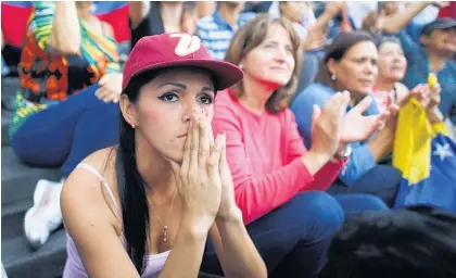  ?? Picture / AP ?? An anti-government demonstrat­or attends a vigil in honour of those who have been killed during clashes between security forces and protesters in Caracas, Venezuela.