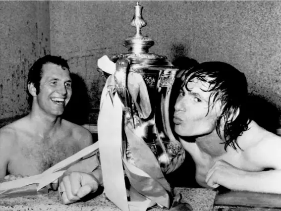  ??  ?? Stokes kissing the FA Cup as teammate Peter Osgood (left) looks on (Getty)