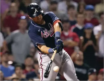  ?? CHARLES KRUPA – THE ASSOCIATED PRESS ?? The Braves’ Austin Riley connects on a two-run single in the 11th inning to cap a five-RBI night against the Red Sox.