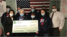  ?? SUBMITTED ?? Volunteers from the Geauga County Veteran Food Pantry look on as representa­tives of Leadership Geauga present a check for $5,640to support Pantry operations. Front row, left to right, Barbara Titus, VP Sheoga Hardwood Flooring and Leadership Geauga’s 2021 Emerald Leader; Lynn Algeri, volunteer Pantry Manager; Pantry volunteers, and Matthew Emrick, former Board President of Leadership Geauga and co-chair of the Emerald Ball. Rebecca Klein, co-chair of the Emerald Ball, was unable to be present.