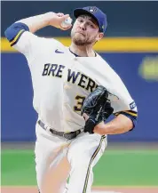  ?? John Fisher/Getty Images ?? Corbin Burnes will start for the Brewers in Game 1 after allowing just four runs over his last 222⁄3 frames.