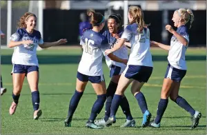  ?? Katharine Lotze/The Signal ?? The Master’s University’s women’s soccer teammates celebrate Gianna Crimi’s (16) goal during a soccer game against Sierra Nevada at The Master’s University on Thursday.
