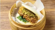  ??  ?? Pepper-salt fried chicken bao offers a well-designed bun and a depth of flavour at Gongfu Bao.