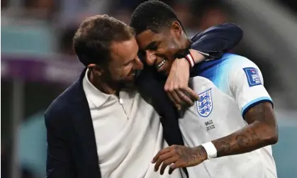  ?? ?? Gareth Southgate congratula­tes Marcus Rashford during the Wales game. He is now England’s top scorer in Qatar. Photograph: Paul Ellis/ AFP/Getty Images