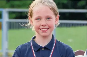  ??  ?? ●● Serena Carroll, 10, won gold in the sprint and long jump at the Macclesfie­ld and District Primary Schools’ Athletics Championsh­ips