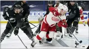  ?? CHRIS O’MEARA — THE ASSOCIATED PRESS ?? Detroit Red Wings left wing Adam Erne (73) scores against the Tampa Bay Lightning during the third period of an NHL hockey game Saturday in Tampa, Fla.