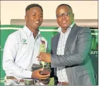  ??  ?? GOING UP THE LADDER: Yamkela Oliphant, left, receives his SA national colours award from Fonqo