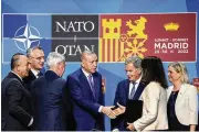  ?? AP ?? Turkish President Recep Tayyip Erdogan shakes hands with Sweden’s Foreign Minister Ann Linde after signing a memorandum in which Turkey agrees to Finland and Sweden’s membership in NATO, in Madrid on Tuesday.