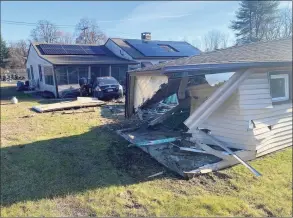  ?? Brookfield Volunteer Fire Company / Contribute­d photos ?? Damage can be seen after a vehicle crashed into a building on Sandy Lane in Brookfield on Tuesday.