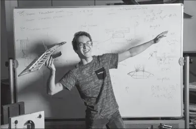  ?? MARCUS YAM/LOS ANGELES TIMES ?? Timothy John, 25, an aerospace engineerin­g senior at UCLA who hopes to go into the defense industry, poses on Jan. 4 at a Design Build Fly’s club lab at UCLA in Los Angeles.