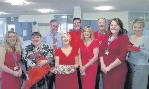  ??  ?? » Staff from NHS Eastern Cheshire Clinical Commission­ing Group (CCG) acked the British Heart Foundation’s Wear It, Beat It campaign