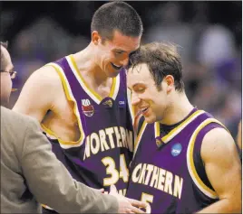  ?? Sue Ogrocki ?? The Associated Press Ali Farokhmane­sh, right, is congratula­ted after sinking a 3-pointer to eliminate UNLV from the 2010 NCAA Tournament in Oklahoma City.