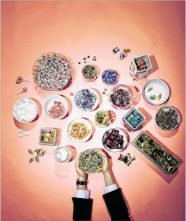  ?? WASHINGTON POST PHOTOS BY MATT MCCLAIN ?? A selection of candy dishes at the Washington Post. As Candy-Disher-in-Chief Ronald Reagan once said of his jar of Jelly Bellys, “You can tell a lot about a fella’s character by whether he picks out all of one color or just grabs a handful.”