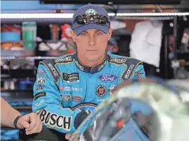 ?? AP ?? Kevin Harvick waits by his car before Friday’s practice for Saturday’s All-Star Race at Charlotte Motor Speedway.