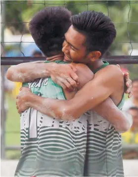  ?? SUNSTAR FOTO / ARNI ACLAO ?? BACK TO BACK. John Kevin Juban (right) and Raphy Abanto (left) of the UV Green Lancers hug as they celebrate after winning the finals for their second straight crown.