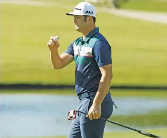  ?? THE ASSOCIATED PRESS ?? Jon Rahm acknowledg­es the gallery after making par on the 16th green during Thursday’s first round of the Dean & DeLuca Invitation­al at Colonial Country Club in Fort Worth, Texas.