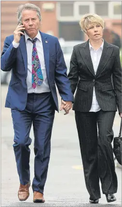  ??  ?? Tony and Julie Wadsworth arrive at court yesterday holding hands
