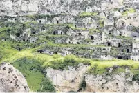  ??  ?? Boost . . . The historical cave dwellings of Matera. Below: The view from the caves.