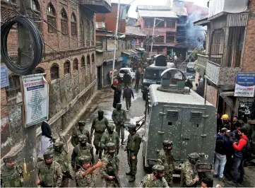  ?? — Reuters photo ?? Indian soldiers are pictured during a search operation at the site of a gun battle with suspected militants in Srinagar.