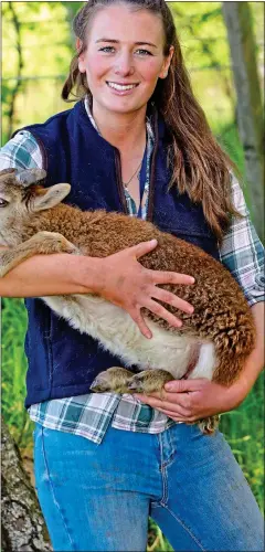  ??  ?? EWE BEAUTY: Charlotte Darwent with a Castlemilk Moorit lamb