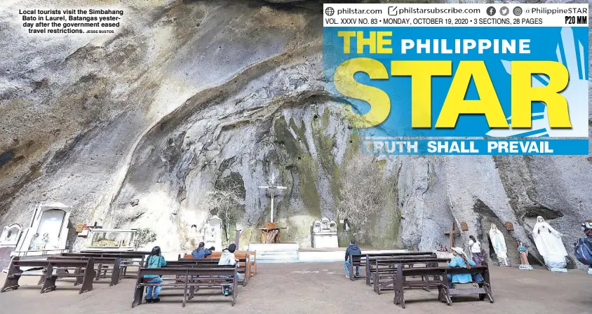  ?? JESSE BUSTOS ?? Local tourists visit the Simbahang Bato in Laurel, Batangas yesterday after the government eased travel restrictio­ns.