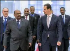  ?? SANA VIA AP, FILE ?? In this file photo released by the Syrian official news agency SANA Syrian President Bashar Assad, right, meets with Sudan’s President Omar Bashir in Damascus, Syria. Assad has survived years of war and millions of dollars in money and weapons aimed at toppling him. Now after nearly eight years of conflict, he is poised to be readmitted to the fold of Arab nations, a feat once deemed unthinkabl­e as he brutally crushed a years-long uprising against his family’s rule.